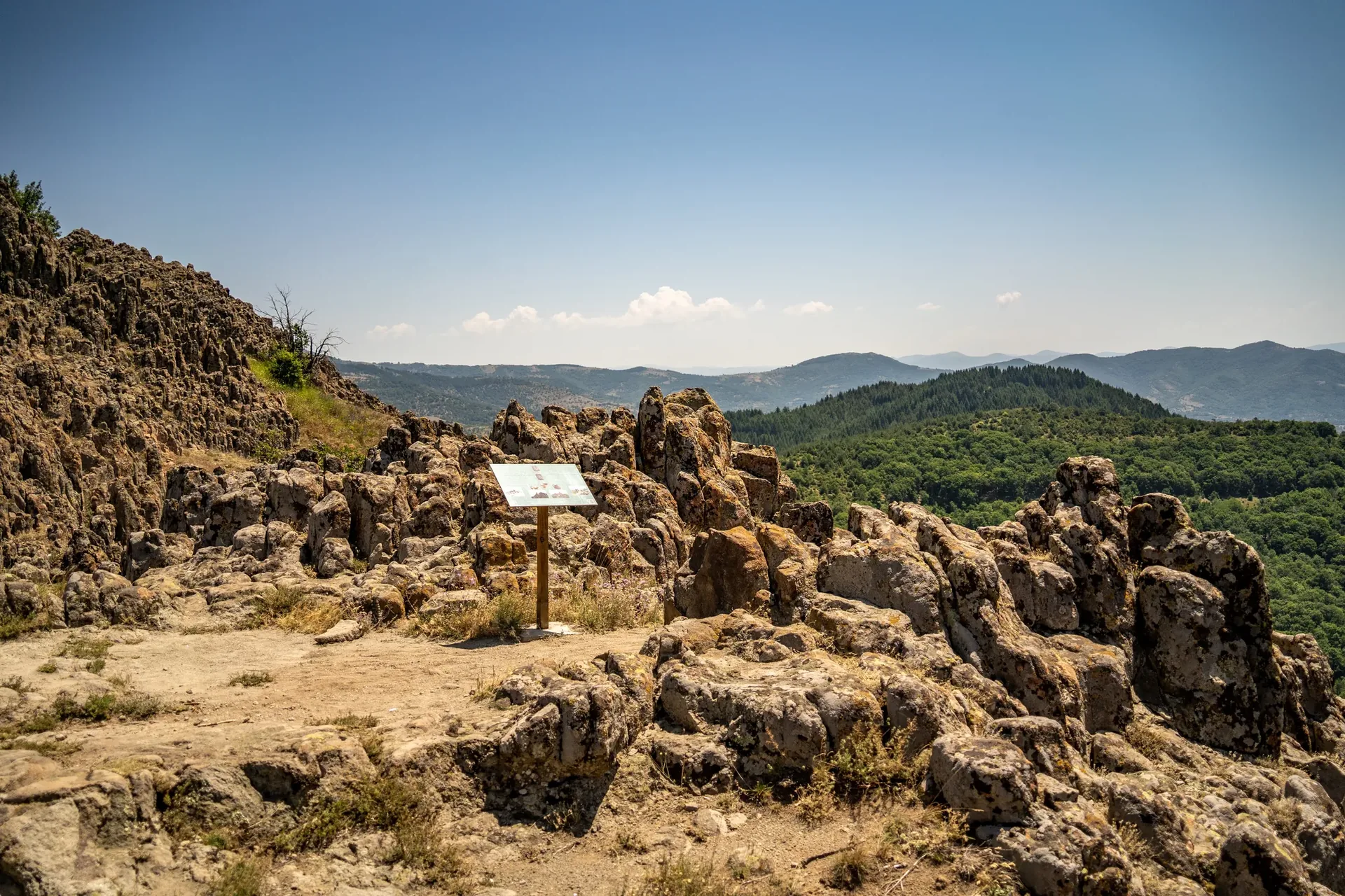 An interpretation panel on the summit plateau at Kokino